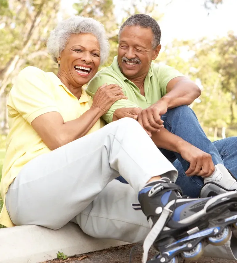 Happy elderly couple walking together on a sunny day